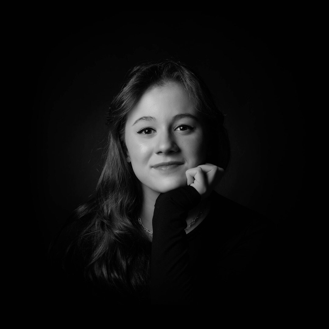 Portrait of a Swiss female journalist in a modern newsroom