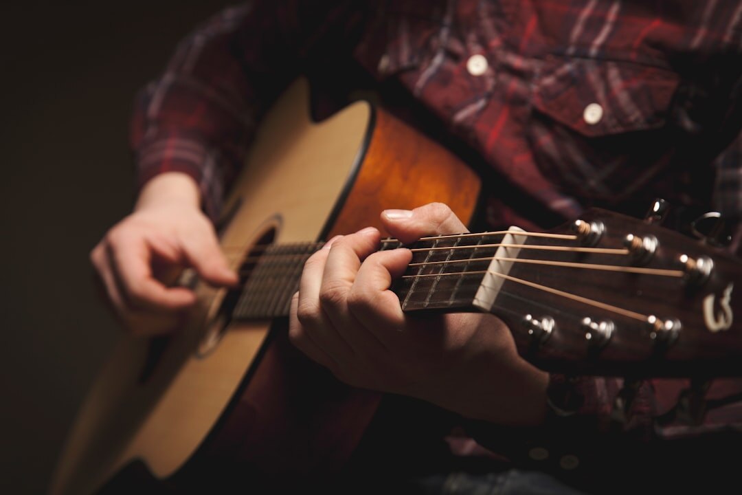 young musician playing guitar